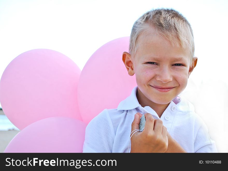 Smiling boy playing with balloons. Smiling boy playing with balloons