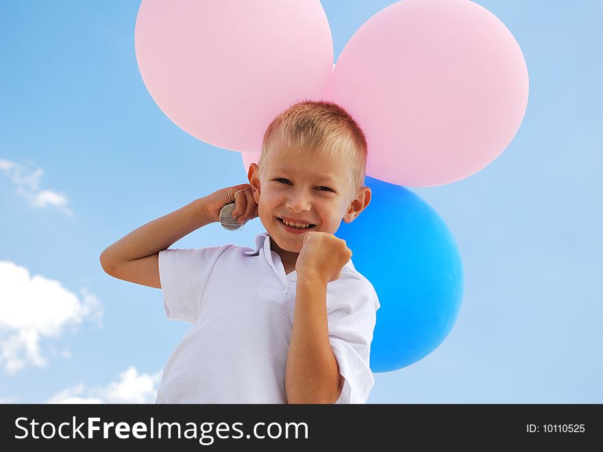 Boy with balloons on sky background. Boy with balloons on sky background