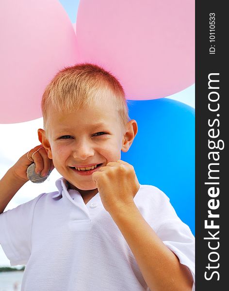 Portrait of boy  with  balloons