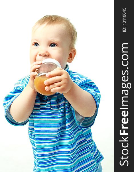 Portrait of a cute baby drinking juice