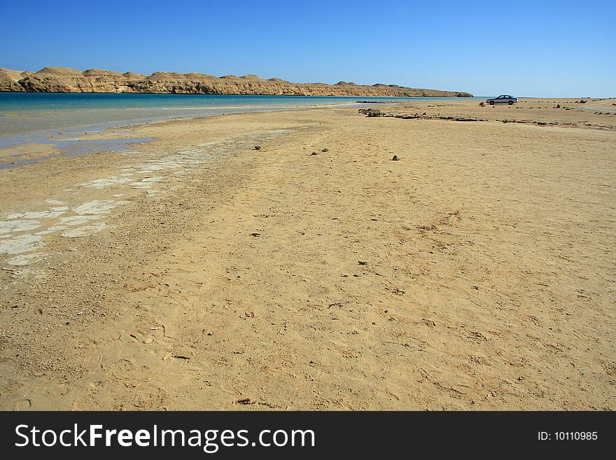 Isolated car parked in the wide egyptian desert. Isolated car parked in the wide egyptian desert