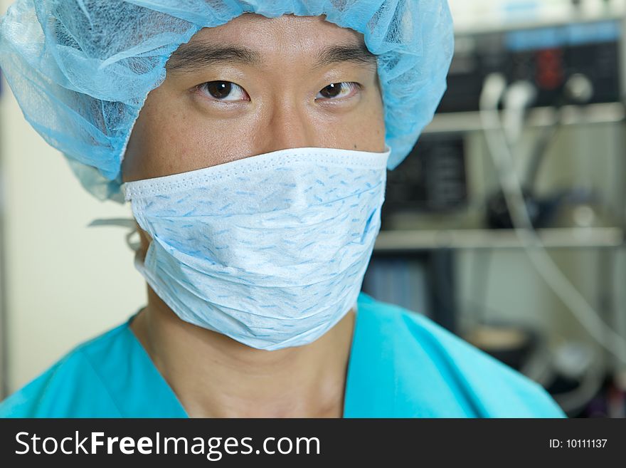 An Asian Doctor working in a hospital