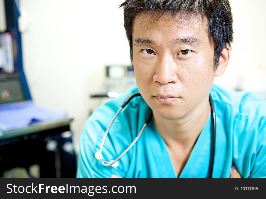 An Asian Doctor working in a hospital