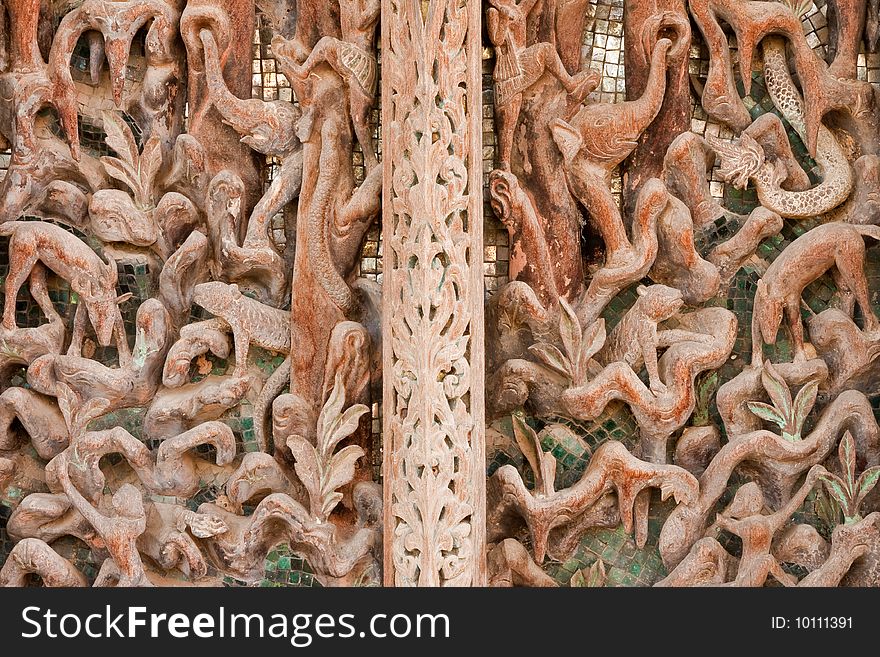 Door of teak wood church, Wat Kut Ti, Petchaburi province, Thailand. Door of teak wood church, Wat Kut Ti, Petchaburi province, Thailand