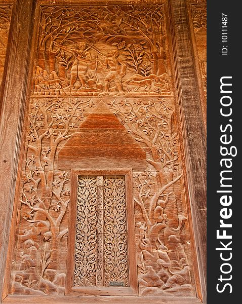 Door of teak wood church, Wat Kut Ti, Petchaburi province, Thailand. Door of teak wood church, Wat Kut Ti, Petchaburi province, Thailand