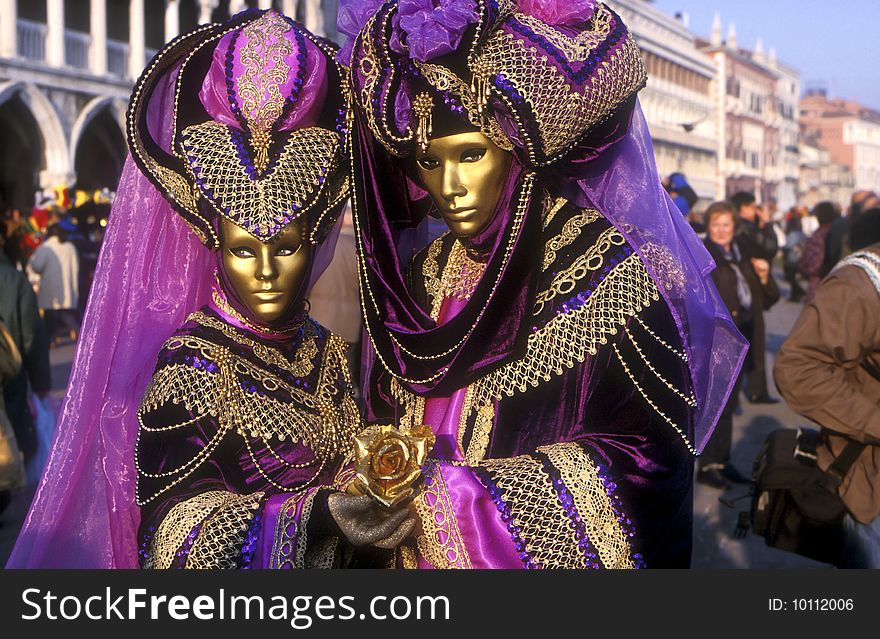 Portrait of two models dressed in Purple for the Venice Carnival. Portrait of two models dressed in Purple for the Venice Carnival