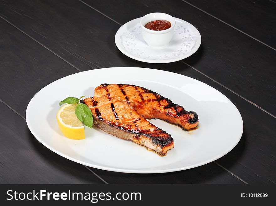 Grilled salmon on the white plate