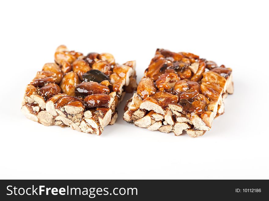 Cereal bars with almods and honey on a white background