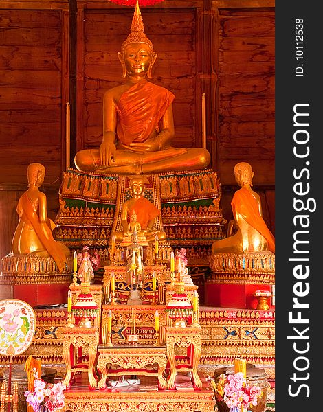 Buddha image in teak wood church