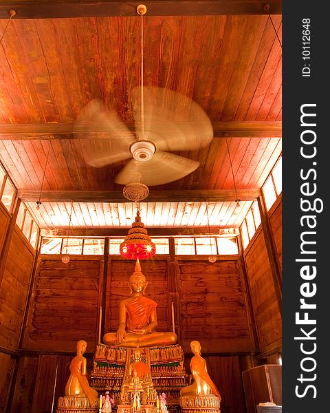 Buddha image in teak wood church