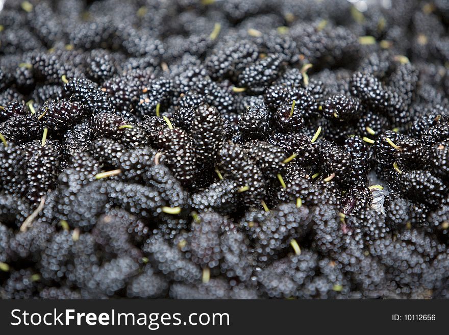 Close up of a group of fresh, succulent mulberries