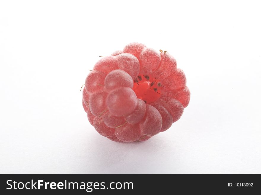 Close up of a raspberry on a white background isolated.