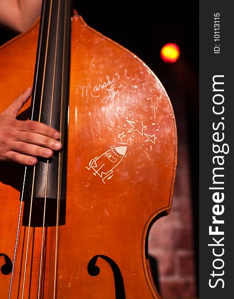 Contrabass with painted rocket and stars. Contrabass with painted rocket and stars