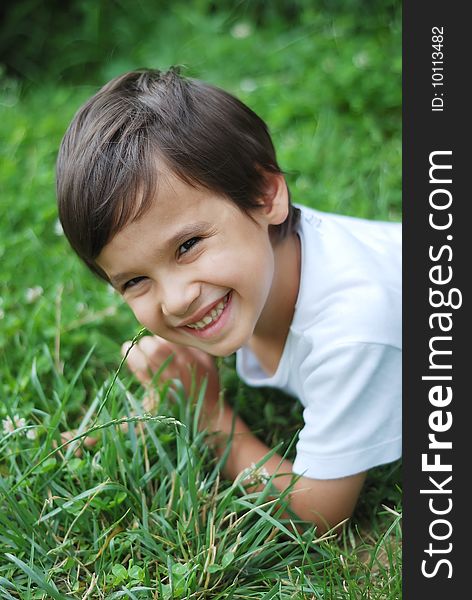 Child laying on the grass