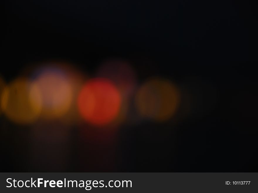 Out of focus tungsten marina bay lights forming a composition at night. Out of focus tungsten marina bay lights forming a composition at night