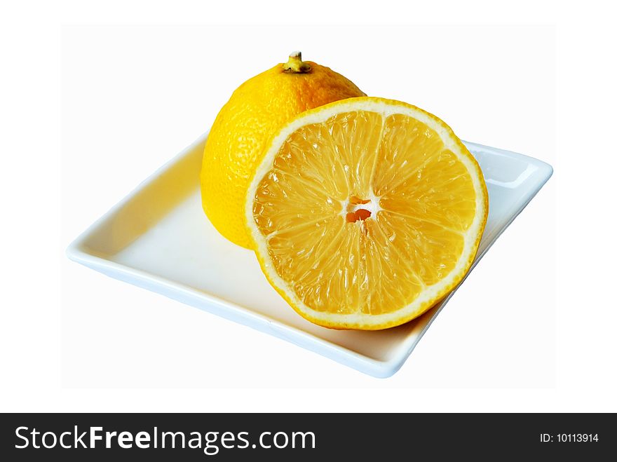 Lemons on square plate isolated on white background. Lemons on square plate isolated on white background