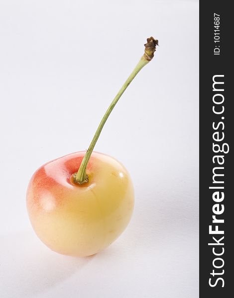 Close up of a white cherry on a white background isolated.