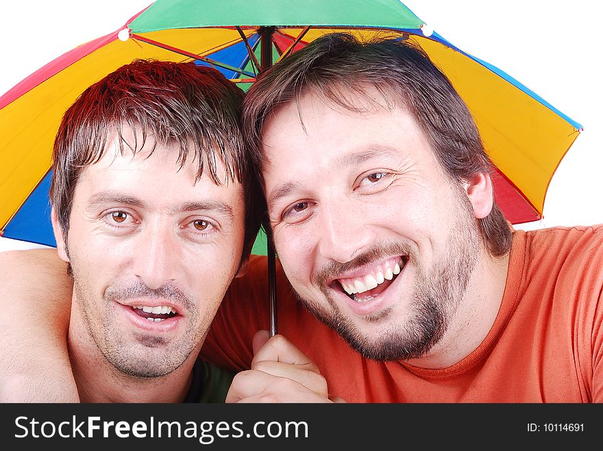 Two funny men are laughing under umbrella