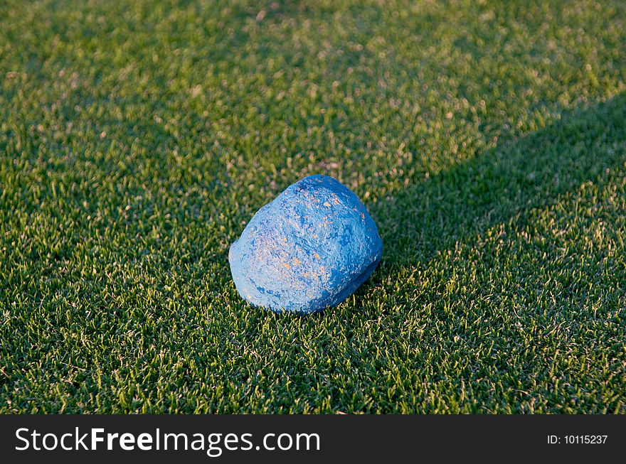 Blue stone in the middle of the grass. Blue stone in the middle of the grass