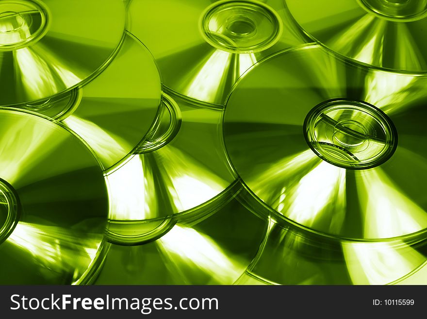 Lime green abstract background of cds. Lime green abstract background of cds.
