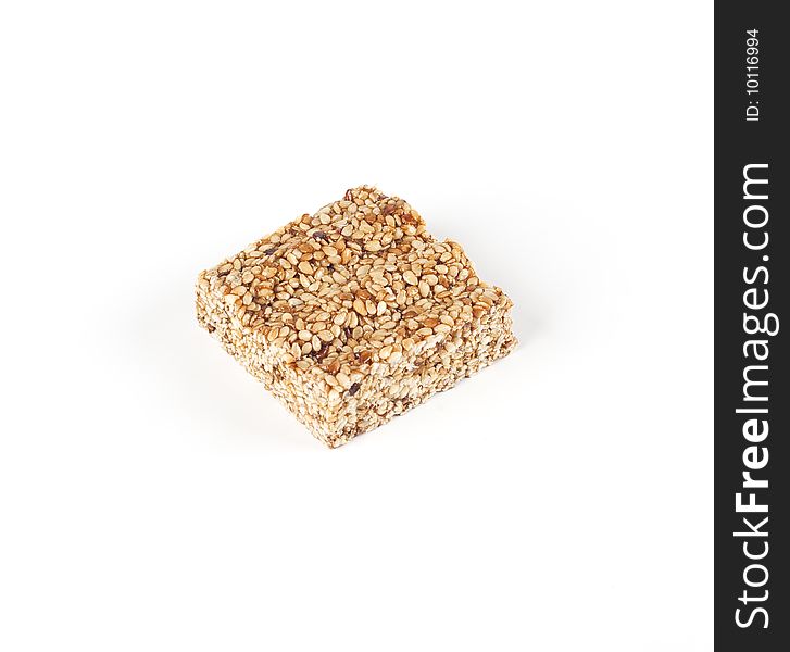 Sesame bar with honey on a white background