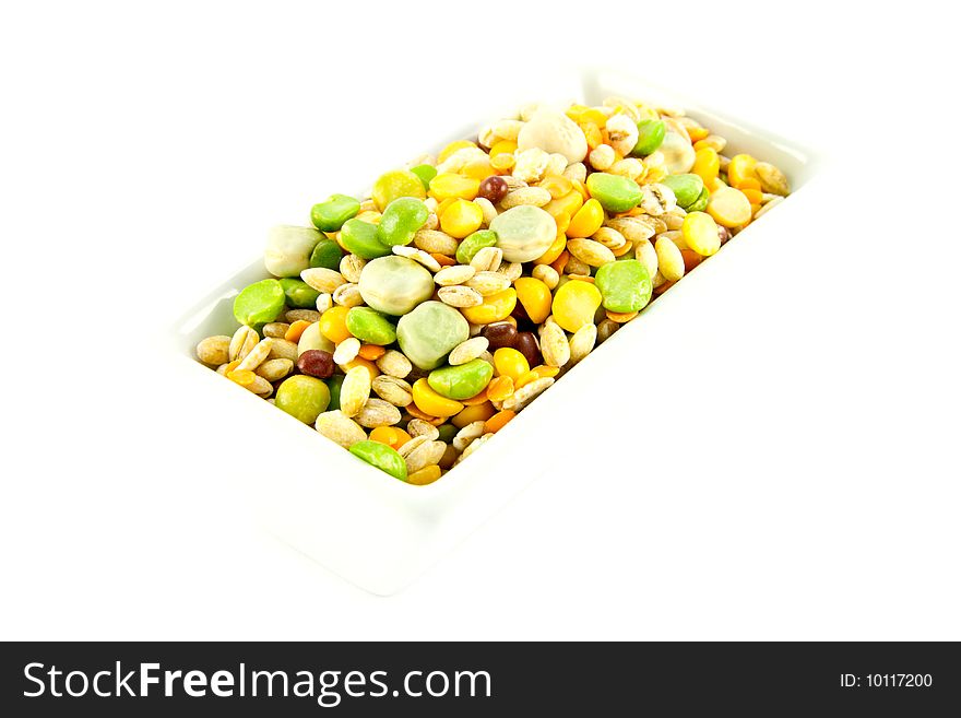 Assorted soup pulses in a dish with a white background