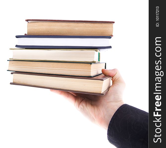 Isolated on a white background stack book on human palm.