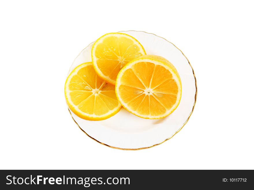 Three slice of orange on a white plate isolated on white