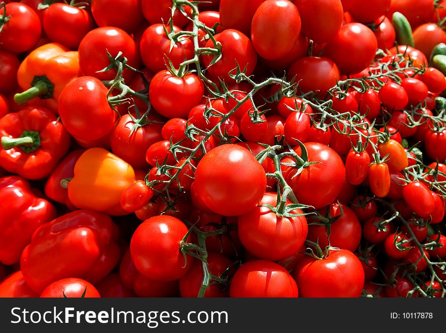 Different kinds of tomatos on a market. Different kinds of tomatos on a market