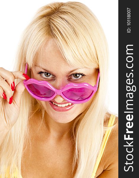 Pretty blonde woman in yellow bikini and rose sunglasses