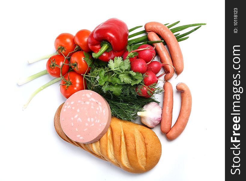 The food - paprika, sausages, wurst, bread,  tomatoes, fennel, garden radish and garlic