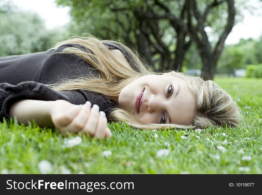 Young woman relaxing in garden