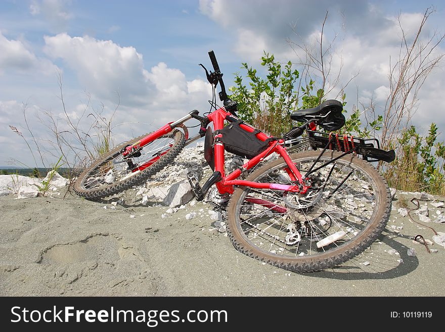 Red mountain bike on a sand hill. Red mountain bike on a sand hill