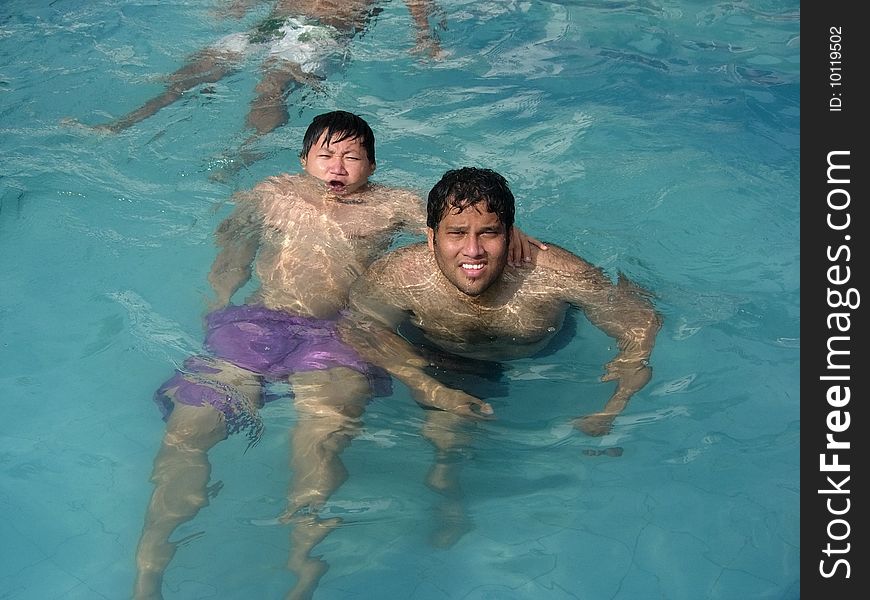 Two friends swimming