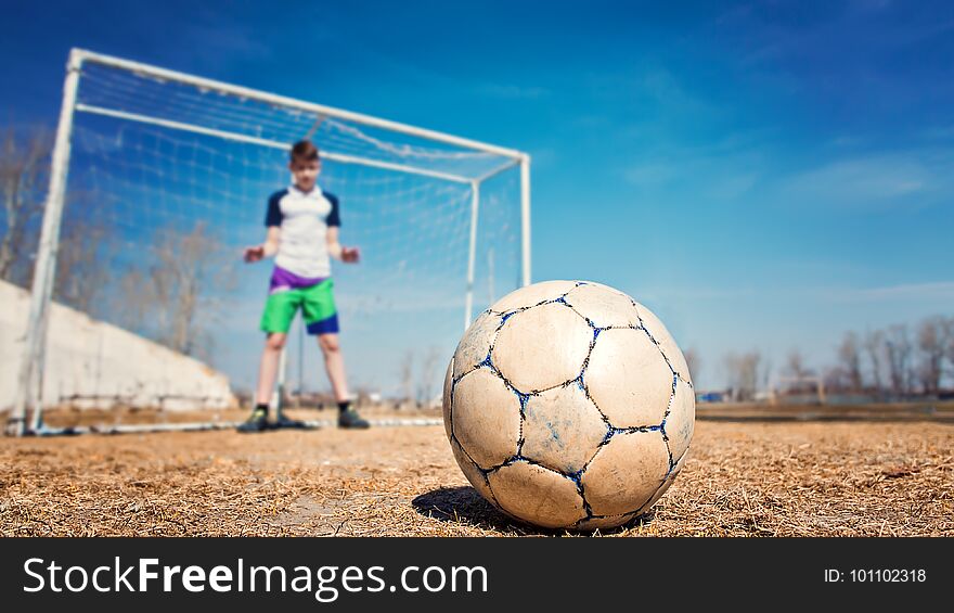 Young caucasian boy teenager goalkeeper catches ball goal soccer. Young caucasian boy teenager goalkeeper catches ball goal soccer