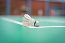Badminton Shuttlecock On Green Court Royalty Free Stock Photo