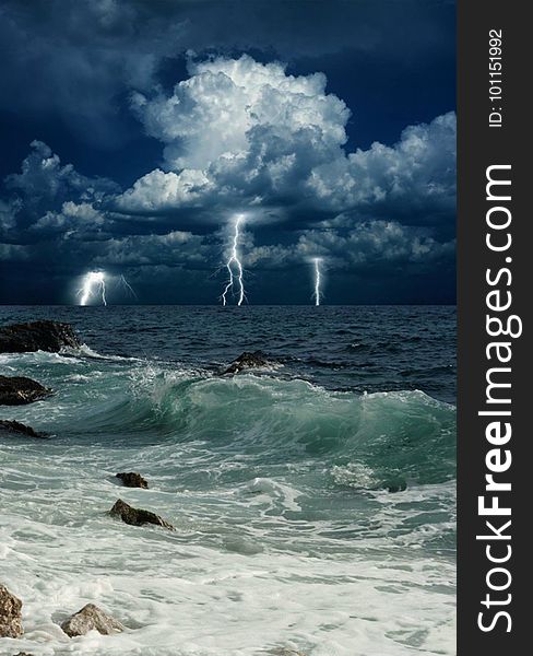 A storm with lightning above the sea. A storm with lightning above the sea.