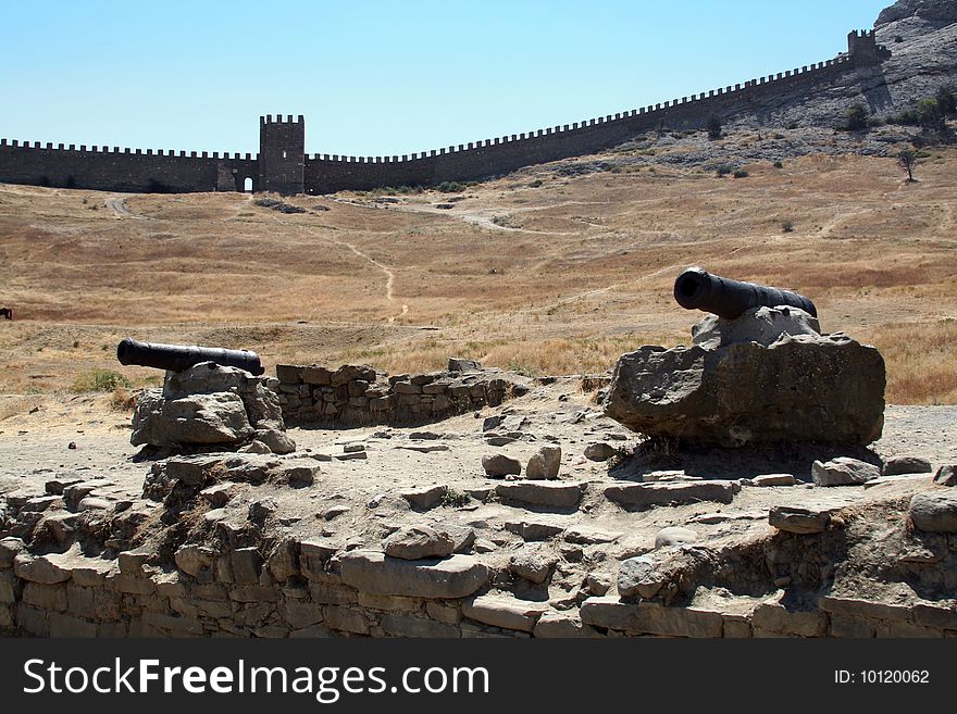 View to the Genoese fortress in Sudak, wall and two cannons, Ukraine. View to the Genoese fortress in Sudak, wall and two cannons, Ukraine