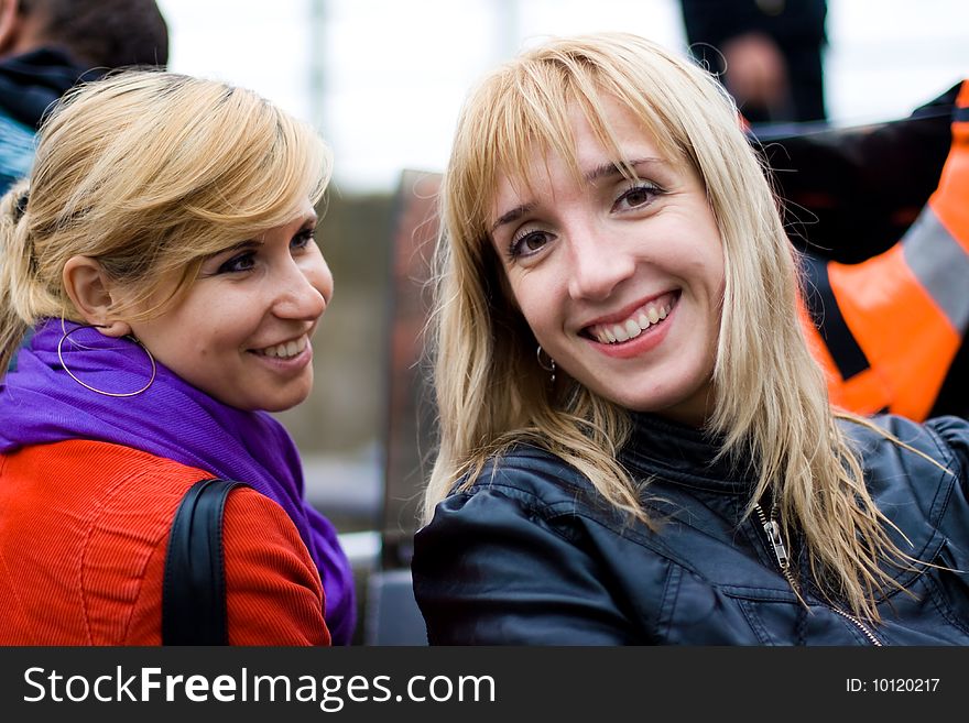 Two beautiful smiling friends girls. Two beautiful smiling friends girls