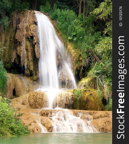 A view of the waterfall in summer.