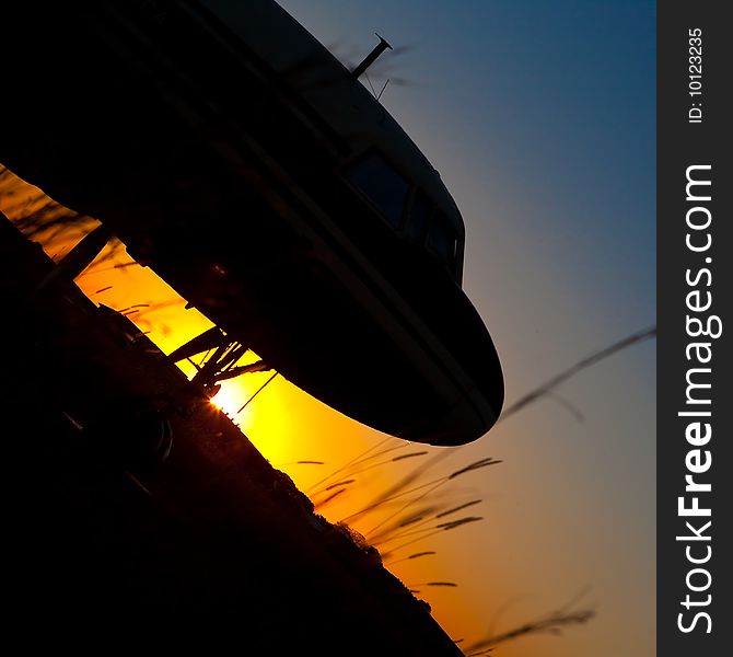 Aircraft Silhouette against setting sun. Aircraft Silhouette against setting sun