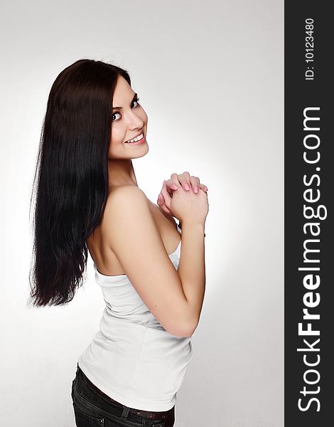 Portrait of beautiful young woman with luxuriant healthy long hair