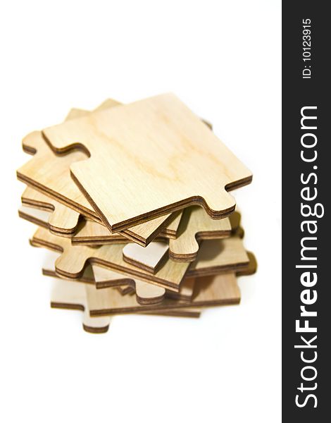 Wooden puzzle on a pile