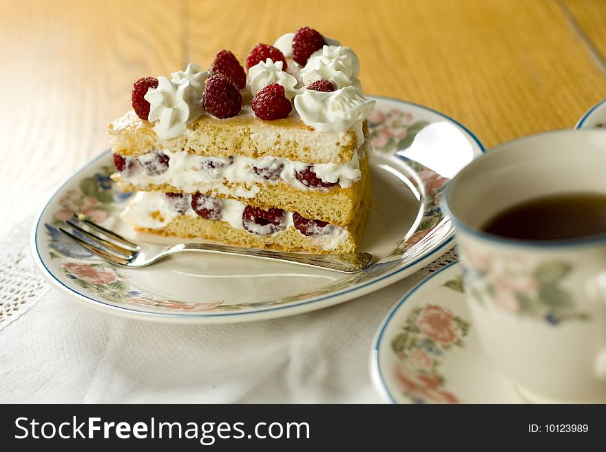 Raspberry cake served with  tea. Raspberry cake served with  tea