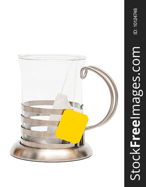 Teabag in a glass with a cup holder on a white background