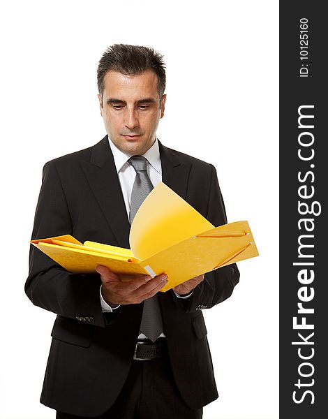 Businessman holds a yellow file from his office