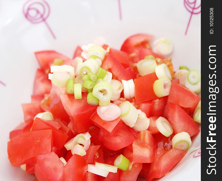 A fresh salad of tomatoes with onions