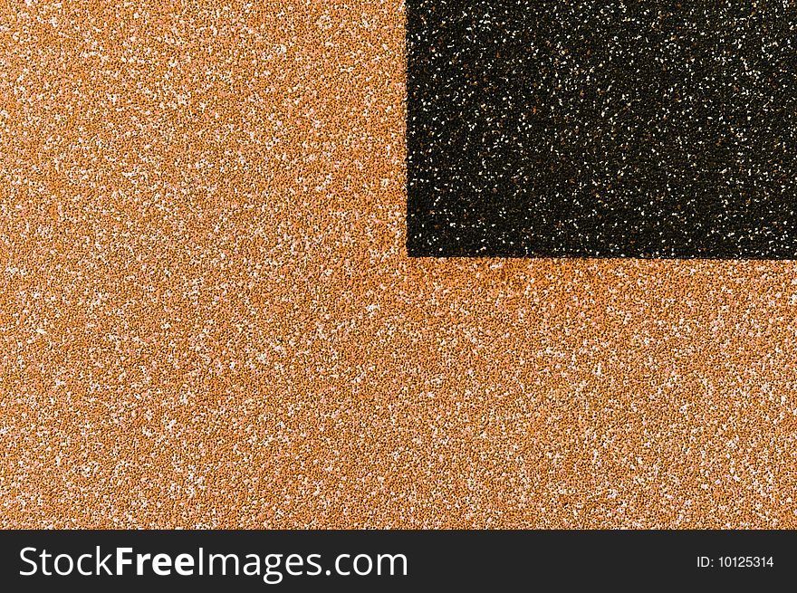 The texture from small white red and black stones with black quarter. The texture from small white red and black stones with black quarter