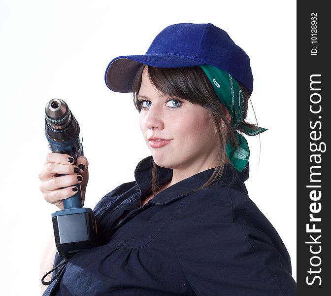 Woman worker holding a battery powered electric drill; isolated on a white background. Woman worker holding a battery powered electric drill; isolated on a white background.