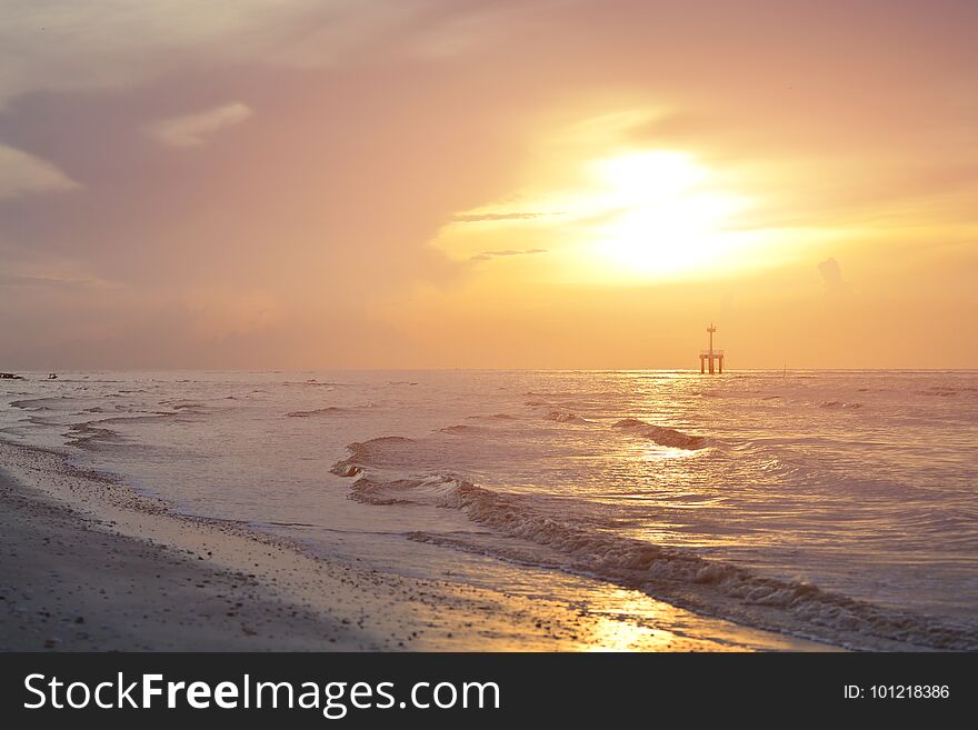 Bright colors at dawn on the beach at sunrise in the Gulf of. Bright colors at dawn on the beach at sunrise in the Gulf of